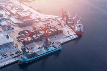 Container cargo ship loading North Arctic port. Concept freight transportation import export and...