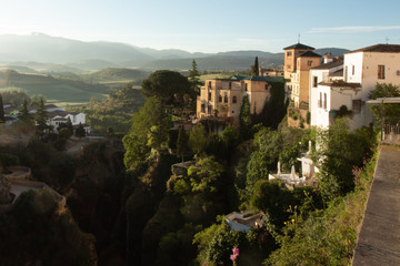 View of the houses over the gorge (canyon), cliffs, shelter plants, Ronda, Andalusia, Spain