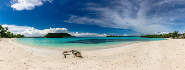Port Orly sandy beach with palm trees, Espiritu Santo Island, Vanuatu.