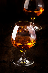 Armagnac, French grape brandy, strong alcoholic drink. Still life in vintage style, selective focus