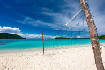 Port Orly sandy beach with palm trees, Espiritu Santo Island, Vanuatu.