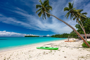 Port Orly sandy beach with palm trees, Espiritu Santo Island, Vanuatu.