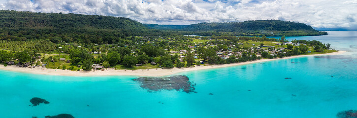 Port Orly sandy beach with palm trees, Espiritu Santo Island, Vanuatu.