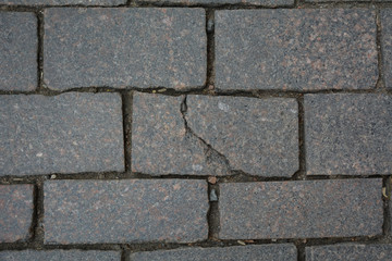 Crack in the stone in the pavement, St.Petersburg, Russia