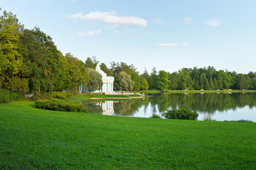 The beautiful Grotto Pavilion (1756) on the banks of the Great Pond on a sunny summer day in the...