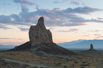Fototapeta na wymiar Trona Pinnacles are nearly 500 tufa spires hidden in California Desert National Conservation Area, not far from the Death Valley National Park, California, USA. Sunset landscape with beautiful rocks.