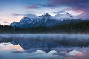Hebert Lake with Mountain Reflection, Banff National Park , Alberta, Canada Beautiful foggy morning...