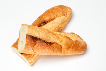 Baguette cut in half. Baguette bread. French bread. Organic baguette francese on white background