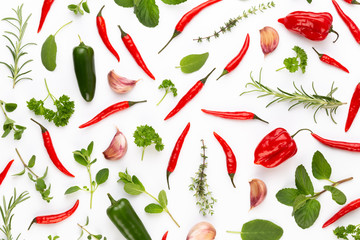 Spice herbal leaves and chili pepper on white background. Vegetables pattern. Floral and vegetables on white background. Top view, flat lay.