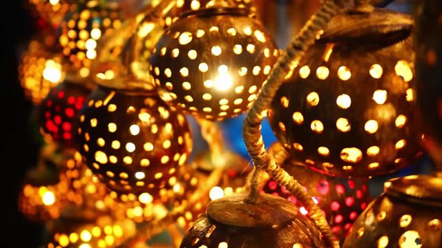 uniquely made lights in a coconut shell being sold in a street  market for decoration.