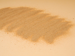 closeup of sand pattern of a beach in the summer