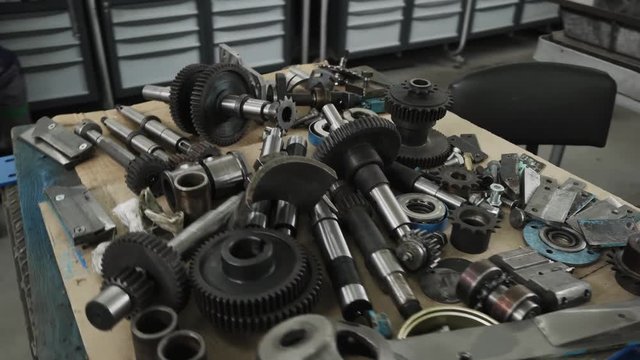 Wooden table with details and tools from outer diameter grinder