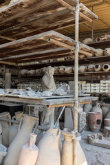 Vessels, pots and a variety of artifacts surviving eruption of Vesuvius in Pompeii  have been excavated and catalogued .Pompei, Italy