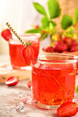 A bottle and glasses with strawberry compote (cider, juice, vinegar). Still life