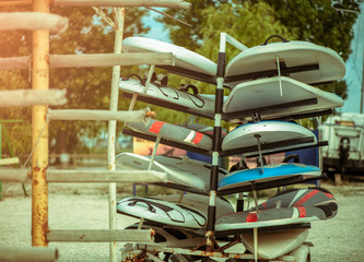 Outdoor mobile stand with surf surfboards and windsurfing for beginners in school