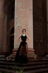 Young attractive woman in sexy see-through, transparent, transpicuous, diaphanous, clear black...