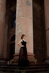Young attractive woman in sexy see-through, transparent, transpicuous, diaphanous, clear black...
