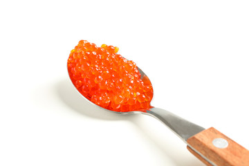 Spoon with red caviar isolated on white background, closeup