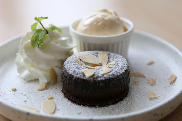 Sliced almonds on a chocolate cake.