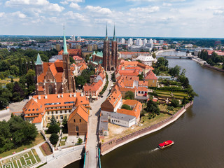 Obraz premium The aerial view of Wroclaw: Ostrow Tumski, Cathedral of St. John the Baptist and Collegiate Church of the Holy Cross and St. Bartholomew