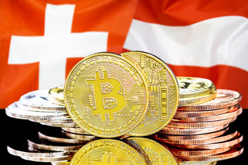 Concept for investors in cryptocurrency and Blockchain technology in the Switzerland and Austria. Bitcoins on the background of the flag Switzerland and Austria.