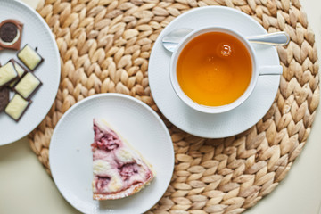 a slice of strawberry pie and a cup of tea