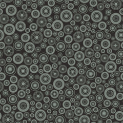 Seamless pattern, background consisting of non-overlapping colored geometric elements of a round shape. Useful as design element for texture and artistic compositions.