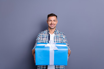 Portrait of his he nice attractive cheery cheerful bearded guy wearing checked shirt holding in...