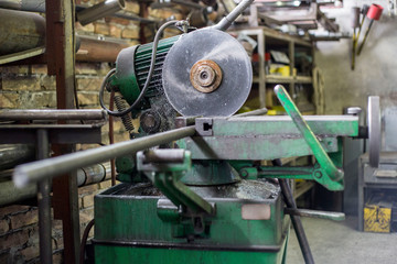 Cutting the metal pipes on a circular saw