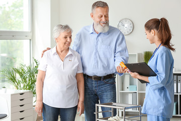Elderly people with caregiver in nursing home