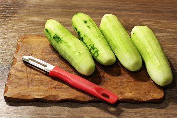 Cucumber on a cutting board. Cook food. Food in the kitchen