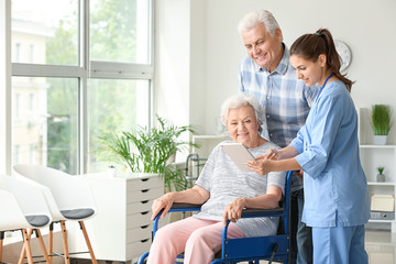 Elderly people with caregiver in nursing home