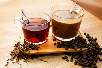 Hot tea and coffee With tea leaves and coffee beans