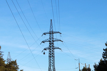 Electrical Pole With Power Lines Against Blue Sky