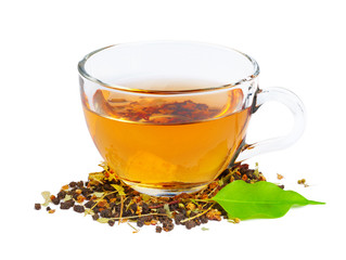 Black tea in a cup of glass. Mint and tea leaves. On white, isolated background