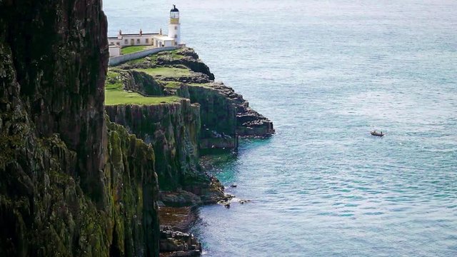Isle of Skye, Neist Point lighthouse at the cliffs on a sunny day