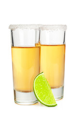 Shot of tequila with a slice of lime no white background