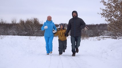 Fototapeta na wymiar Family on country run walk in winter