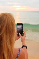 woman taking photo with digital camera