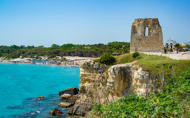 Fototapeta na wymiar Holiday in Apulia. The bay of Torre dell'Orso, with its high cliffs, in Salento, Puglia, Italy.