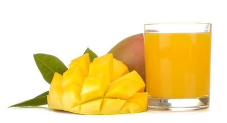 Ripe fresh mango fruit and mango juice in a glass on a white isolated background. tropical fruit