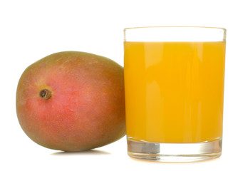 Ripe fresh mango fruit and mango juice in a glass on a white isolated background. tropical fruit