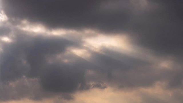 Fast moving evening cloud 4k time lapse movie, dark sunset cloud black gray white amazing glow light, cloudscape time lapse 4k background.