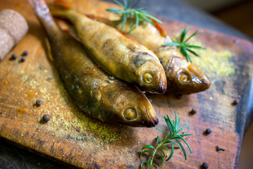 smoked flavored fish on a plate with spices