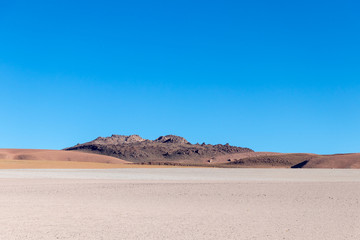 Background with barren desert scenery in the Bolivian Andes, in the Nature reserve Edoardo Avaroa
