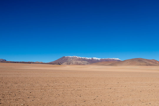 Background with barren desert scenery in the Bolivian Andes, in the Nature reserve Edoardo Avaroa