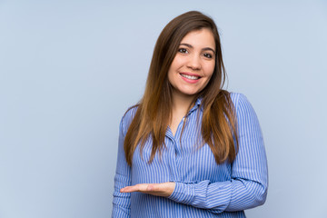 Young girl with striped shirt extending hands to the side for inviting to come