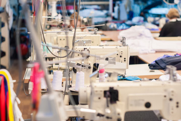 industrial sewing machines in a garment workshop