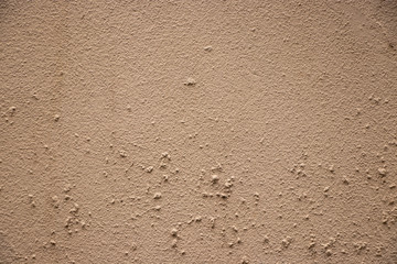 Beige painted grunge wall rough texture