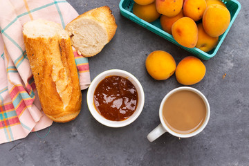 breakfast with apricot jam and slice of bread